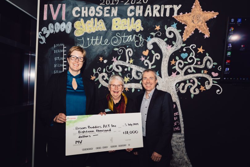 Christine Murray, Meyer Vandenberg with Shelley Atkin, Bosom Buddies ACT, and John Morrissey proudly smile as the celebrate raising $18,000 for the local charity.