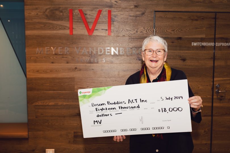 Shelley Atkins accepting the $18,000 donation raised by the staff at Meyer Vandenberg. All funds will be used for local charity Bosom Buddies ACT.