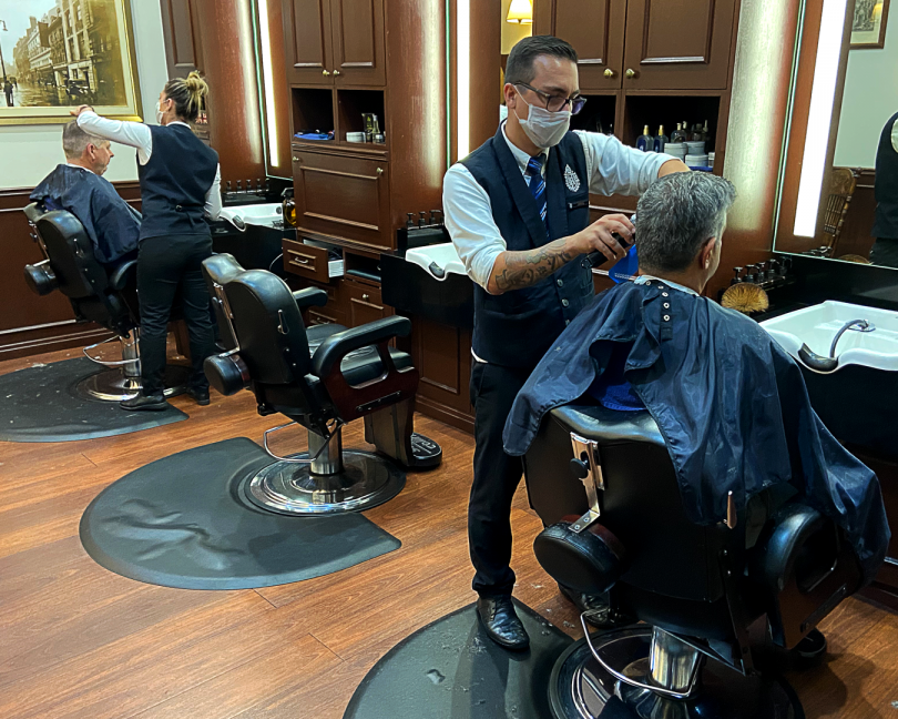 Barbers cutting hair at Truefitt & Hill in Civic