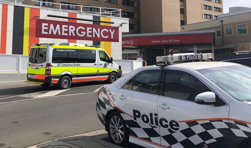 Ambulance and police car outside Canberra Hospital.
