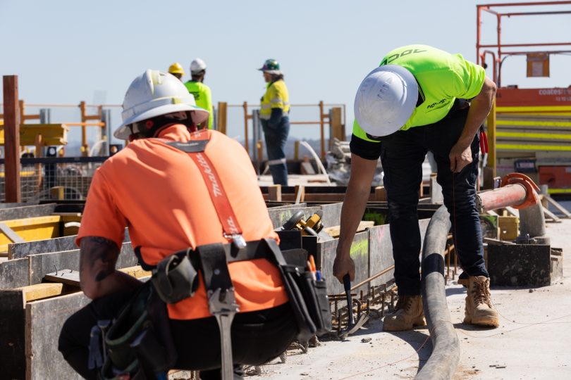 Workers onsite at Geocon's Grand Central Towers in Woden