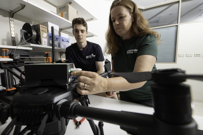 Dr Debbie Saunders and Liam Kennedy setting up a drone in a lab