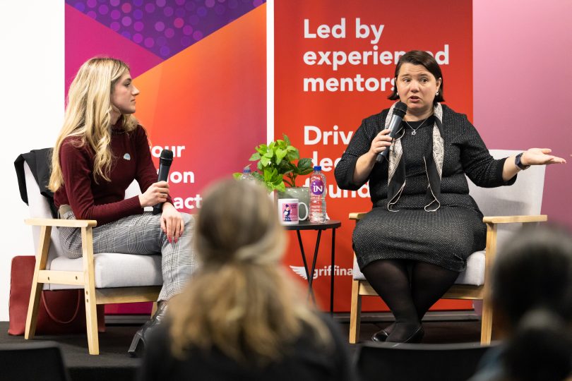 Rae Knopik and Serina Bird speaking onstage at Canberra Innovation Network event