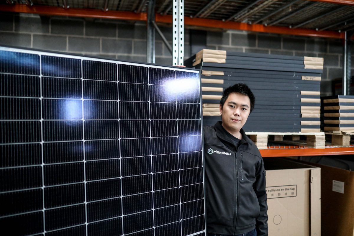 Leo Wang with solar panel