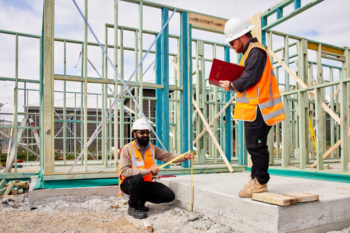 Two workers on a building site.
